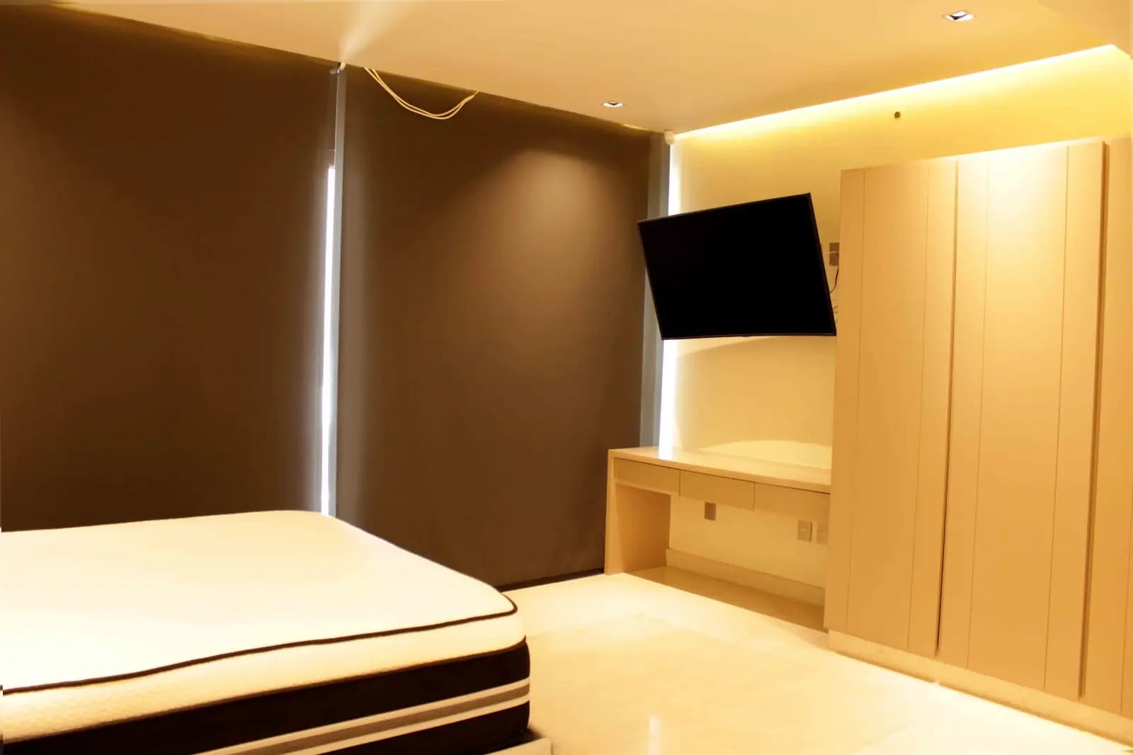 Casa Marina in Puerto Cancun, Bedroom with warm wood finishes