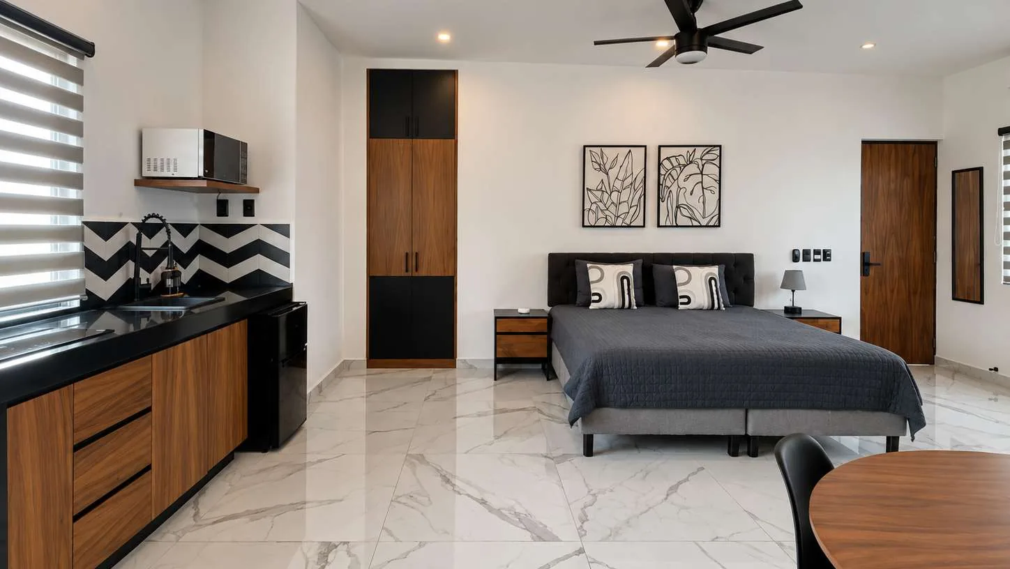 Área social del loft en Cumbres, Cancún
